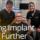 two doctors smiling with patient in dental chair